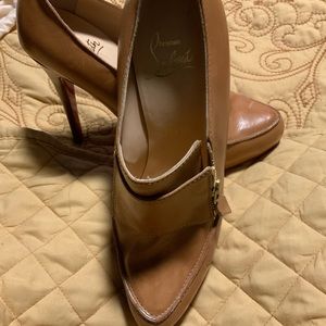 Size 39.5 tan Christian Louboutin shoes.